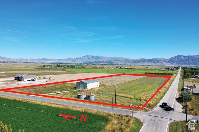 Drone / aerial view featuring a mountain view and a rural view