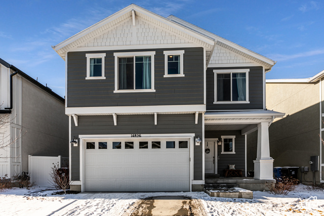 View of front of property with a garage