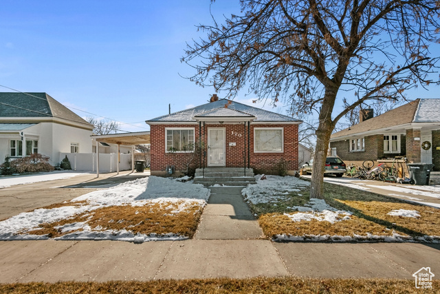 Bungalow-style home with a carport