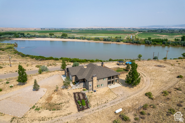 Drone / aerial view with a water view and a rural view