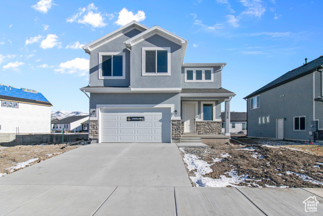 Front of property with a garage