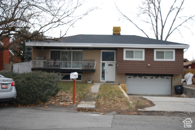 View of front of property with a garage