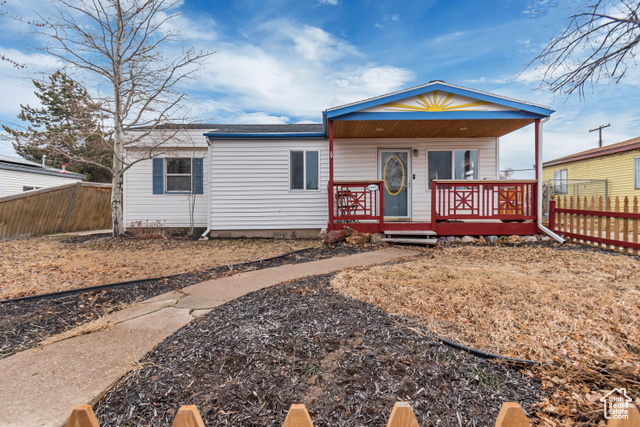 View of front of property with covered porch