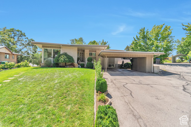 Location, location, location! This updated contemporary home is in the Pleasant View neighborhood that borders Lavell Edwards Stadium and the Marriott Center. Enjoy all that BYU has to offer within steps of your front door. Home has all the modern conveniences while retaining its character and craftsmanship, including an updated kitchen with quartz countertops & stainless steel appliances, wood floors, media room with built-in surround sound speakers and projector (included), and a master suite with an oversized walk-in closet. With four bedrooms and two bathrooms, plus a basement apartment (2 bed, 1 bath), there is plenty of room for your family while also generating rental income to help supplement your morgage payment.