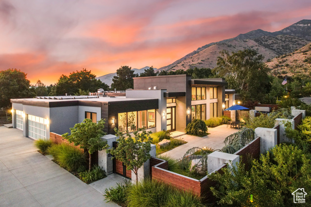 Modern home featuring a garage and a mountain view