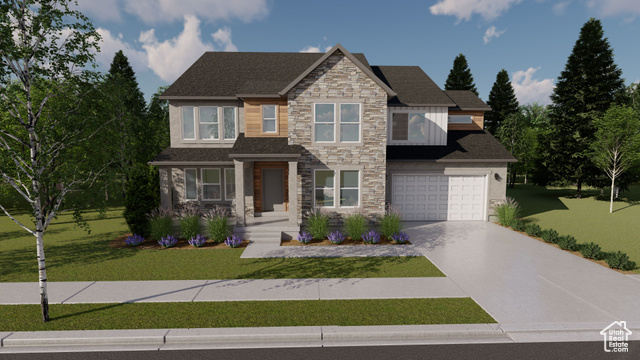 View of front of property with a garage and a front yard