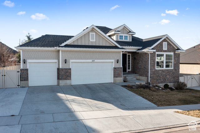 Craftsman-style home featuring a garage