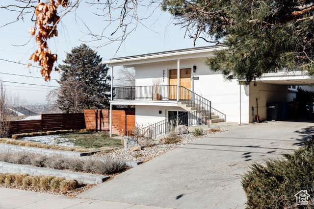 View of front of property with a carport