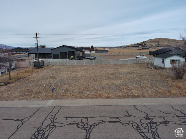 View of yard featuring fence and central air condition unit