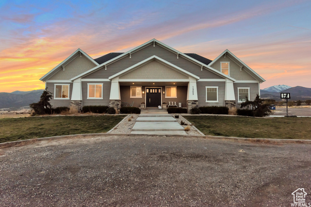 Welcome to this expansive 19.99-acre ranch in Cedar Fort, offering endless space and stunning views. This custom Craftsman-style home features heated wood and tile floors, built-in cabinetry, and a thoughtfully designed layout with 5 bedrooms, 3.5 bathrooms, and a spacious mudroom. The opportunity of almost 20 acres of land is zoned single family and agricultural. The  three-car garage includes RV parking, while the gourmet kitchen is perfect for culinary enthusiasts. Large windows frame breathtaking views of the desert valley and lush mountain backdrop. The property has a private well with water rights, multiple outbuildings, fenced pastures, and gigabit fiber internet wired to the home. Current owners have a dog boarding business next to the home, the business is getting sold with the property as well. This is an awesome opportunity for country living with modern comforts!  MORE PICS COMING SOON!