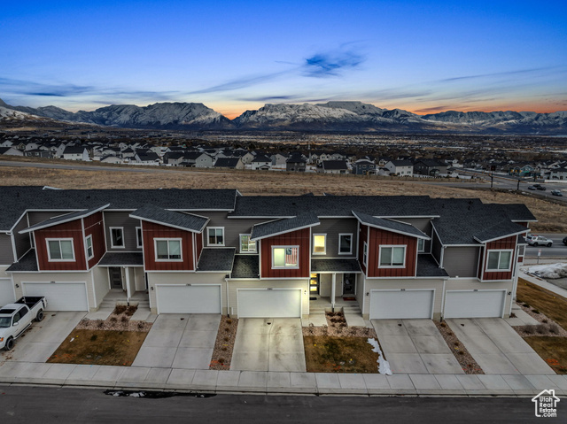 Welcome home to the sweetest deal you've been searching for! Perched in a secluded Saratoga Springs community, this stunning 2-story townhome offers breathtaking views of the Wasatch Mountains. Designed with tall ceilings, abundant natural light, and a spacious open-concept layout, it checks all the boxes-without stretching your budget! The main floor is perfect for both relaxation and entertaining, while the upstairs offers optimal livability. The thoughtfully designed kitchen features a large quartz island, oversized cabinets, and a seamless connection to the dining and family rooms. Upstairs, you'll find a spacious primary suite, two additional bedrooms, and well-appointed bathrooms. The home also includes a two-car garage and an unfinished walkout basement-ideal for extra storage or future expansion. Step outside to a private patio, perfect for unwinding after a long day. Don't miss this incredible opportunity-schedule your showing today!  Please reach out to Abe Mardanlou at 801.664.1546 to schedule a private showing to see this amazing property. Grand Open House on 2/22/2025 from 11am - 1pm.