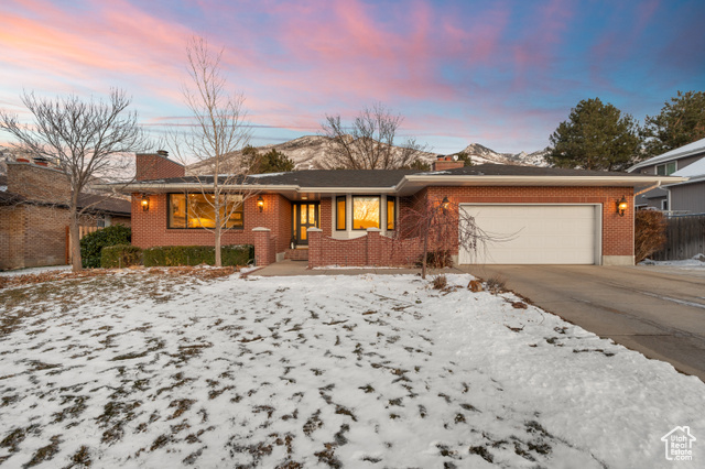 Step into luxury with this beautifully remodeled home, where impeccable craftsmanship meets modern elegance. Rich white oak floors, custom cabinets/built-ins, and plush wool carpet elevate the main floor, while triple-pane Anderson "Low E x3" windows and glass doors provide comfort and efficiency throughout. The chef's kitchen is a masterpiece, featuring a La Cornue double oven range, a Wolf built-in microwave, a Wolf steam oven, a Miele dishwasher, and a high-end Scotsman pebble ice maker. Sleek marble countertops extend seamlessly into a full marble backsplash, enhancing the kitchen's sophisticated design. Unwind in the spa-like primary bath with heated tile floors, then cozy up by one of three gas fireplaces. Thoughtful upgrades include a new Lochinvar self-cleaning tankless water heater and newer gutters with guards to ensure peace of mind. Enjoy breathtaking mountain views from the spacious backyard, offering privacy with no rear neighbors. Nestled in a pristine Cottonwood Heights neighborhood with top-rated schools, this home provides unbeatable access to Big and Little Cottonwood Canyons, as well as nearby shopping, dining, and outdoor recreation.