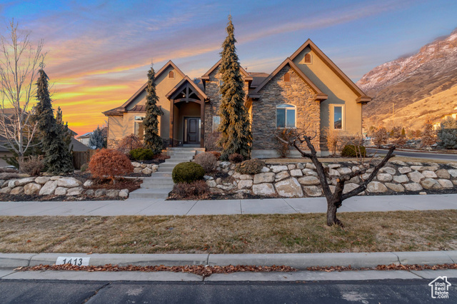 Located on Provo's east bench foothills, just below Y mountain. Beautiful 2 story, fully finished with 2 kitchens, 2 laundries, w/outside basement  entrance. Main floor Master with spacious bath & walk-in closet. Office with coffered ceiling, formal dining, great room w/ 2 story windows & 2 sided fireplace. Large open custom kitchen w/built in desk & Island bar. All appliances included in both kitchens & laundry rooms. Finished basement has a workout room or could be a 3rd bedroom downstairs. 3 Car Garage with full epoxy floors, custom built in cabinetry, wall organizers & shelving. Garage fridge included. Fully fenced back yard with mature landscaping, walk out deck and large patio. Gas BBQ is included. Terraced front yard, impressive curb appeal with large open porch. Beautiful sunset views. Blocks from Peaks Indoor Ice Rink, Splash Mountain Water Park  and minutes from BYU campus.