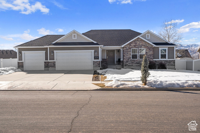 Beautiful Rambler style in Heber valley's sought-after neighborhood, wheeler park.  This well maintained home offers the perfect combination of modern comforts, energy efficiency, and ideal location.  With 3 bedrooms and 2 baths all on the main floor, this home is designed for convenience, accessibility, and effortless living. Bright and open layout with vaulted ceiling and large windows for natural light.  The homes efficient heating and cooling systems ensure year-round comfort, while the active solar system saves dramatically on energy costs. A huge highlight of this property is the oversized 3 car garage, plenty of space for vehicles toys or workshop.  The fully fenced yard offers privacy, with plenty of room for outdoor entertainment and play.