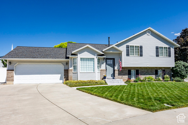 This fully finished 5-bedroom, 3-bath home offers a perfect blend of modern updates and inviting spaces. The open-concept design welcomes you with abundant natural light, while the recently updated kitchen boasts stunning granite countertops, newer stainless steel appliances, and ample cabinetry-ideal for entertaining and everyday living. Step outside to a beautifully landscaped backyard, complete with garden boxes for homegrown produce, a professional-quality putting green, and a spacious newer shed for additional storage. The huge lot provides plenty of room for outdoor gatherings, relaxation, or play, all while enjoying breathtaking mountain views. With thoughtful upgrades throughout, this move-in-ready home offers both style and functionality in a serene setting. Don't miss the opportunity to make it yours!