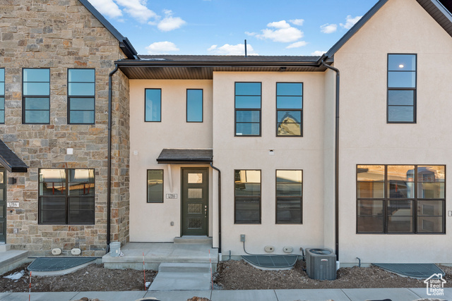 This Sundborn Townhome offers a stylish and functional living space all in a great Heber community!  The kitchen highlights function & charm with white laminate cabinets, quartz countertops, and stainless steel gas appliances, creating a sleek and modern look. The flooring combines laminate hardwood, vinyl tile, and carpet, providing a mix of durability and comfort throughout the home. The owner's bathroom features cultured marble shower surrounds, adding a touch of luxury, with black matte hardware that enhances the home's contemporary aesthetic. An upstairs loft provides extra space for relaxing and the metal railing at the stairway adds an elegant design element, making this townhome a perfect blend of modern finishes and practical living. Come check it out today!