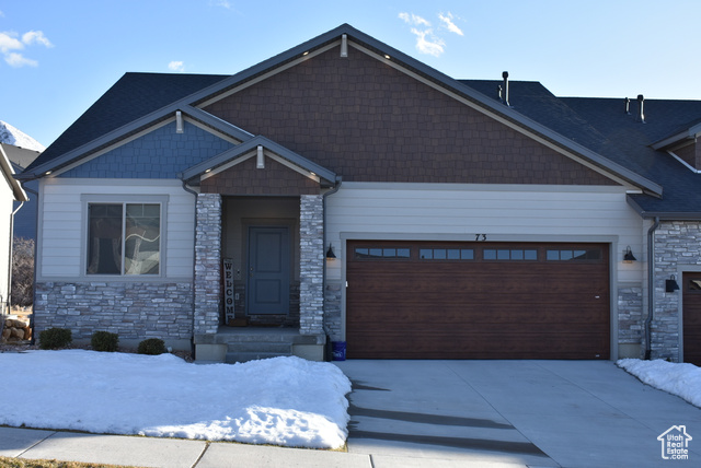 Come see this stunning Craftsman-style residential twin-home located in beautiful Elk Ridge, Utah and located in the foothills of the mountains and just minutes to Gladstan golf course.  This 3-bedroom, 3 full bathroom rambler provides a complement of luxury, spacious design and comfort for your enjoyment.  The kitchen is a culinary delight with its large center island which is great for preparing and serving your gourmet meals, gorgeous cabinetry, gas cook-top range and other high-end appliances including double ovens, dishwasher, and fridge.  There's plenty of room for entertaining or just relaxing in the large great room just off the kitchen and large ding area.  Vaulted ceiling and large windows provide a bright open atmosphere, and the gas-log fireplace proves a cozy warm and inviting feeling. The master bedroom is a perfect retreat with a grand master bathroom you'd find in homes of much greater value and size with its separate tub and shower, spacious walk-in closet and double basin vanity.  There's also a front living room/den just as you enter the home, and the laundry room is conveniently located on the main floor just between the garage and kitchen.  Did I mention that the front load washer and dryer are included!  Off the back of the home is the large deck where you can enjoy the serenity of open space, surrounding mountain views and beautiful skies.   The finished basement features 9-foot ceilings and lots of upgrades. There's a large open gathering room with lots of built-in shelving and counterspace.  Two additional bedrooms with large walk-in style closets, and a 3rd full bathroom.  The home has an efficient HVAC system, gas water heater and water softener.  The 2-car garage also has a 50AMP plug for EV vehicles. Although it is a 55+ community, there is an allowance for buyers under 55. It is priced to sell. Come get this one before it's gone.    Square footage figures are provided as a courtesy estimate only and were obtained from Utah County Records .  Buyer is advised to obtain an independent measurement.