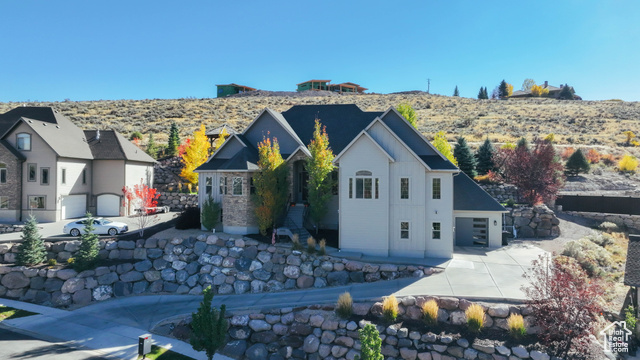 1908 Callaway isn't just a home-it's a front-row seat to some of the most breathtaking views in Heber Valley. The massive alcove-style flex room right off the main living area is an absolute showstopper, offering a panoramic overlook of Mt. Timpanogos and the rolling farmland of Midway. It's the kind of view you have to see to believe-expansive, unobstructed, and completely unforgettable.  The backyard is just as impressive. Private, peaceful, and perfectly designed for enjoying the outdoors. No neighbors behind you, just the natural landscape rising up for total seclusion. Mature trees add privacy to one side, and the multi-tiered layout gives you options-an inviting covered patio right off the back door, plus a second terrace with a gazebo and fire pit that feels like its own retreat.  Inside, the home is pristine. Every inch has been meticulously maintained, and the layout delivers space in all the right places. The main level flows beautifully, while downstairs offers even more room, including a massive bonus space (currently a gym) that can be whatever you need it to be.  And the location? Just minutes from Jordanelle, Deer Valley's East Village expansion, and the upcoming Marcella Club-home to Tiger Woods' new championship golf course. Whether you're into skiing, golf, or just being close to everything happening in Heber Valley, this spot puts you right in the middle of it all.  If you're looking for a home that feels as good as it looks, this is it. Schedule your showing-because once you see these views, you won't want to leave.