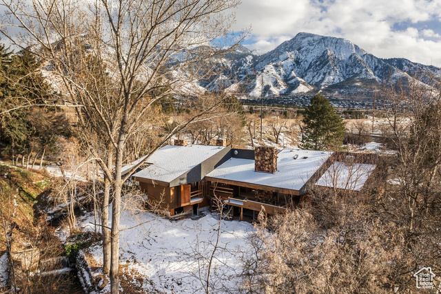 A rare opportunity to reimagine an architectural treasure on the bank of Mill Creek. Spanning 1.8 acres, this private estate is set against the dramatic backdrop of towering Mt. Olympus and along the peaceful stream, offering breathtaking views and a serene, country-like setting. Designed by renowned mid-century architect Ed Dreier, this contemporary homestead stands as a tribute to timeless design, now awaiting its next chapter. The residence has been meticulously taken down to its structural core, fully reinforced and primed for transformation, all work performed by Jackson Leroy. With permitted interior and exterior design plans available, the visionary owner can bring this legacy estate back to life with ease. The property consists of four parcels, presenting a unique opportunity for a savvy investor. With potential to develop and ample space for a second residence, this estate presents a rare opportunity to maximize value for a high-end investment property in one of Utah's most sought-after locations. Beyond its architectural significance, this estate offers the rare benefit of low cost water and irrigation rights, ensuring lush, verdant grounds year-round. Nestled in coveted East Millcreek, the location is unparalleled-just a short 15-minute drive to downtown Salt Lake, and only 30 minutes to Park City, Silicon Slopes, and world-class skiing and hiking.