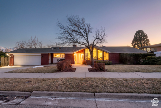 Wonderful High Avenues mid-century classic with high vaults, windows galore, stunning mountain and city views plus a huge .35 acre lot! Architectural integrity and character! Extensive hardwood floors. Beautiful travertine fireplace in the living room and a vintage modern brick fireplace in the family room. Open, spacious floorplan. Kitchen has windows front to back on three sides. Lovely living dining spaces flow to a view deck. Main floor primary with birch built-ins, great dual wardrobes and a cool modern bath with wide view windows. Three nice bedrooms are down plus a glass office. Tons of closets and storage including a 400 sq. ft. concrete space with yard access under the garage. The curb appeal is great and the light and feel inside is amazing. This is a rare fully usable lot. Dream spot in the ultimate location!