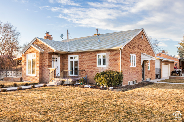 **Fully Functional ADU**  Welcome to this enchanting blend of historic charm and modern convenience in central Springville! Situated on a corner lot near schools and attractions, this meticulously renovated brick home exudes warmth and character. Inside, discover custom cabinetry, granite countertops, and elegant tile work, plus two fireplaces and large windows framing mountain views.  The sunlit upstairs kitchen boasts oversized picture windows, a farmhouse sink, and ample storage. Downstairs, a fully functional ADU-with its own kitchen, family room, bathroom, and two bedrooms-offers ideal rental income potential. Enjoy four spacious bedrooms with built-in closet systems, and two beautifully renovated bathrooms featuring spa-like tilework.  Laundry facilities on both levels make chores a breeze, and a whimsical under-the-stairs book nook delights little ones. Outside, the fully fenced backyard features mature flowering trees, a covered patio, a she shed, raised garden beds, fruit trees, a sand pit, and even a chicken coop! The extra-large two-car garage includes attic storage, while extra off-street parking accommodates a boat or trailer. Modern upgrades like a new HVAC system and a newer 50-gallon water heater ensure comfort and efficiency. Don't miss this rare find where historic charm meets modern comforts. Schedule a private showing today and make this captivating Springville retreat your dream home!