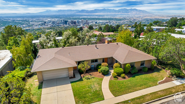 This modern ranch-style home is located in a perfect location with some of the best views around! This property features a modern kitchen, open floor plan, ensuite bed/bath, & large windows across the entire home w/ valley views. Home has tons of light, 2 large storage rooms, large den/office, & 2 fireplaces. This home has a walk out basement w/ full kitchen, laundry, & mother in law apt. Enjoy this fantastic large lot w/ mature trees, full landscaping, & private patio. With tons of charm & the best views around, this 6 bed, 3 bath home is a must see! Buyer to verify all info.