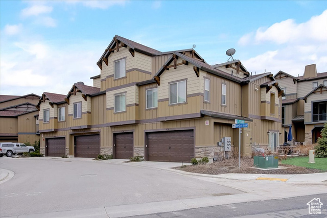 This stunning corner-unit townhome offers the perfect blend of comfort, style, and convenience on the outskirts of Park City. With easy access to world-class ski resorts-including Deer Valley, Park City Mountain, and Canyons-as well as Jordanelle State Park and endless mountain recreation, adventure is always within reach. Designed for effortless living, this home is being sold fully furnished, making it a true turnkey opportunity, especially with short-term rentals allowed in the community. Upgraded finishes throughout and expansive windows invite an abundance of natural light, creating a warm and welcoming atmosphere. Don't miss your chance to own this exceptional mountain retreat! Square footage is provided as a courtesy estimate from county records; buyers are advised to obtain an independent measurement.