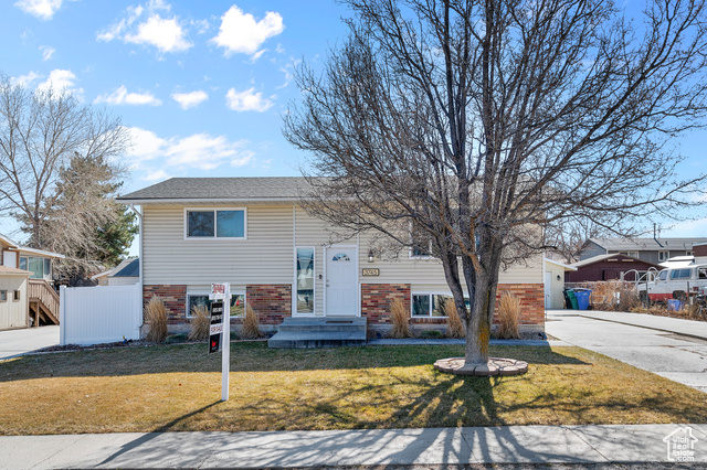 Come check out this updated and exceptionally well maintained home conveniently located less than 5 minutes from Jordan Landing and Bangerter Highway.  Enjoy an instant income opportunity with the mother-in-law basement with its own separate entrance! The home includes 2 updated kitchens, 2 living rooms, and 2 laundries with all appliances included!  Other features include an extra deep garage and plenty of RV parking, fully fenced back yard with a patio, playground, and fire pit, 2 sheds, and added insulation in the home for extra efficiency. This is one of those rare deals that will go fast so call soon!