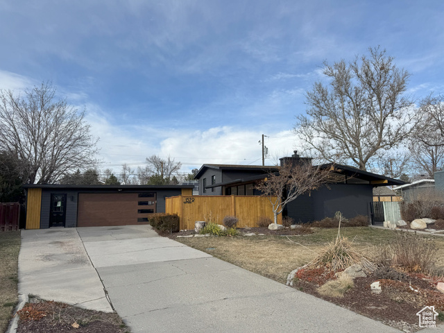 This stunning Mid-Century Modern home in Murray offers 1,750 sq. ft. of fully remodeled living space on a spacious lot with a large, fully fenced backyard-ideal for pets and outdoor entertaining. An oversized detached garage provides versatile space for storage or creative endeavors. Prime Location: Situated in a quiet, family-friendly community, the home grants quick access to highways, Fort Union shopping, dining, and schools like Woodstock Elementary and Bonneville Jr. High, all within walking distance. Chef's Dream Kitchen: Features luxury soft-close cabinets, stainless steel appliances (including a Bosch gas stove), quartz waterfall countertops, and modern snap-in flooring throughout the upper levels. Sophisticated Design: Highlights include a beautiful tile-accented wooden staircase, solid-core interior doors with craftsman-style casing, and elegant oil-rubbed bronze hardware. Spa-Like Master Suite: Boasts an oversized walk-in closet with frosted glass sliding doors and a custom-built shoe closet. The master bath offers a dual-head shower, custom tile work, a floating vanity, and designer lighting for a daily spa experience. Energy Efficiency: Upgraded windows with high energy standards, helping to maintain comfortable utility bills. The inviting front patio is perfect for morning coffee or evening relaxation. No detail has been overlooked in blending style, luxury, and comfort. Schedule your private showing today! Note: Square footage is an estimate from county records; buyers are advised to obtain an independent measurement.