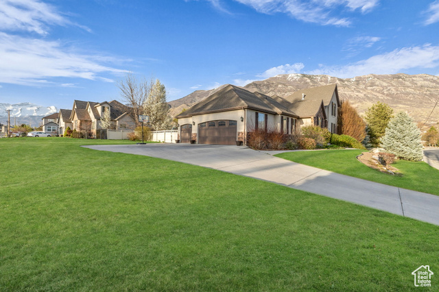 888 W 2800 N Pleasant Grove, Utah Welcome to this magnificent two-story home in the desirable Heritage Estates community of Pleasant Grove! Situated on a half-acre corner lot with beautiful mountain views, this 4,945 sq ft home offers the perfect blend of comfort, style, and functionality. Built with all the right touches, this stunning 6-bedroom, 5-bathroom residence features an open floor plan with soaring vaulted ceilings and abundant natural light. The main level showcases a spacious great room with a cozy fireplace, elegant formal living area, and a gourmet kitchen with granite countertops and stainless steel appliances. The main floor master retreat provides a private sanctuary with an en-suite bathroom featuring separate shower and tub. The upper level offers additional bedrooms perfect for family members or guests. One of this property's most valuable features is the attached 780 sq ft accessory dwelling unit (ADU) with its own bedroom, bathroom, kitchen, laundry and separate entrance-ideal for rental income, multi-generational living, or a show stopping home office. Outdoor living is a dream with a fully fenced yard, mature landscaping, fruit trees, and automatic sprinkler system. Enjoy mountain views from your patio while entertaining. The property also includes rare hard to find zoning including livestock privileges, perfect for equestrian enthusiasts. Additional features include a 3-car attached garage, central vacuum system, plantation shutters, and a super convenient location near excellent schools, shopping, and recreation. Don't miss this exceptional opportunity to own in one of Pleasant Grove's most sought-after neighborhoods! Square footage figures are provided as a courtesy estimate only and were obtained from County Records . Buyer is advised to obtain an independent measurement and to verify all info.