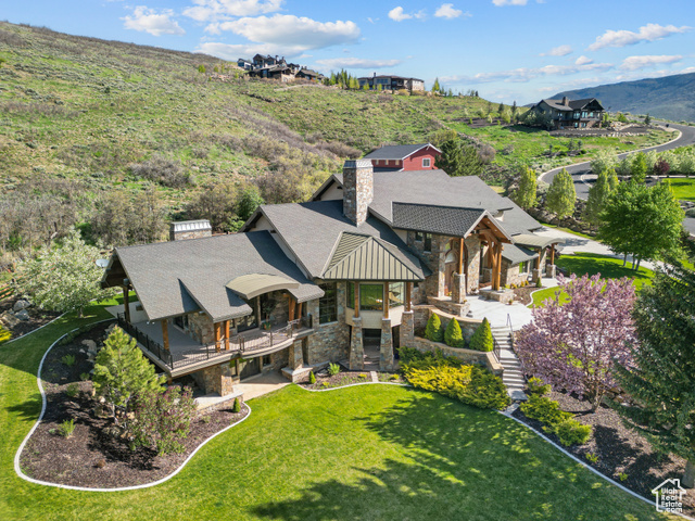 2499 RIVER MEADOWS LN Midway, Utah Welcome to Midway's most iconic and customizable estate - a once-in-a-lifetime legacy property on 5.74 acres backing directly to Wasatch Mountain State Park. This one-of-a-kind horse property features a sprawling 12,104 SF main home with 6 luxurious ensuite bedrooms and 9 bathrooms. Every detail has been crafted for elevated living - from soaring ceilings and a stately library to a private sauna, movie theater, and a downstairs that could literally host a ballroom party. Underneath the garage, you'll find a massive cold storage room that could easily be transformed into a state-of-the-art gun room or indoor shooting range. Outdoors, relax in the private hot tub or hop on your snowmobile or horse and head straight into the mountains. The property also includes an 8,424 SF two-level barn. Upstairs is a dream venue for weddings or large-scale entertaining. Downstairs? The ultimate man cave or luxury showroom - perfect for housing all your cars, boats, and RVs. Plenty of room for all your toys. With no HOA, a private well, this estate offers unmatched freedom and versatility. Build a third structure like a guest home or caretaker's cottage. Gate and landscape it for total seclusion. If Glenwild and Deer Valley had a baby and dropped it in Midway, this would be the house. Bring your vision. The possibilities are endless.