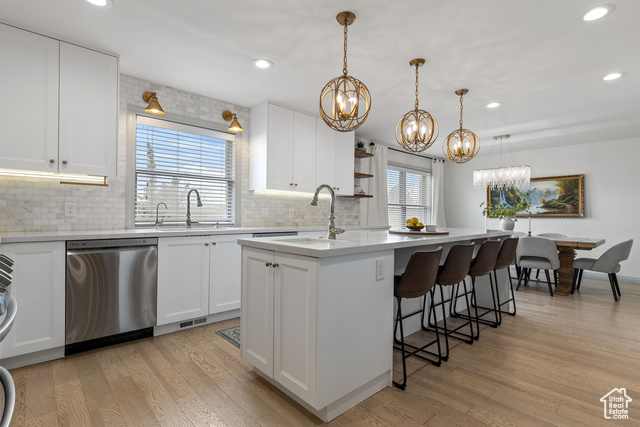 56 S 1000 E Springville, Utah Discover this breathtaking 6-bedroom, 3.5-bathroom masterpiece in a cul-de-sac on the coveted east side of Springville, just 3 minutes from Art City Elementary and Springville Jr. High, and less than 15 minutes from BYU. Step inside to discover a semi-open floor plan filled with natural light, custom millwork, and warm hardwood floors. The kitchen has been beautifully renovated, featuring dual dishwashers, a double oven, double sinks, under cabinet lighting, quartz countertops, marble backsplash, and soft close floor to ceiling cabinetry. The bathrooms have also been updated, boasting a modern comfort and style, while a brand-new roof offers peace of mind. Enjoy hosting friends and family in a spacious dining area, comfortable main floor and basement living rooms, and a versatile main floor bedroom, currently used as a cozy TV room. Downstairs, a fully finished walkout basement features a private apartment-ideal for guests, rental income (currently leased at $1175/mo), or multigenerational living. Enjoy outdoor living in the fully fenced backyard with a covered patio, two-story playhouse, and tiered gardens. This home has it all-style, functionality, and prime location. Schedule your private tour today and turn this dream home into your reality. Square footage per county records; buyer to verify.