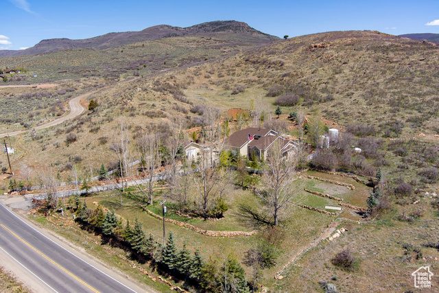 4851 E LAKE CREEK RD Heber City, Utah Welcome to your private sanctuary nestled just outside Heber City, offering tranquility and space on nearly 5 acres of versatile land. Whether you choose to keep it as one expansive parcel or potentially subdivide into three, this property provides incredible options for privacy, investment, or future development. Step inside to soaring ceilings and abundant windows that flood the home with natural light. The open-concept layout creates a warm and inviting atmosphere throughout.Two additional bedrooms and a 3/4 bathroom upstairs offer privacy and comfort, with stunning views of Mount Timpanogos. The basement features an open-concept design, a separate entrance suitable for mother-in-law quarters, plumbing for a second kitchen, two bedrooms, and a full bathroom-perfect for multi-generational living or rental opportunities. Enjoy gatherings on the expansive tiered deck lounging space, encircled by beautifully crafted tiered rock retaining walls that enhance the landscape and provide privacy. The outdoor space is perfect for entertaining, relaxing, and enjoying the scenic mountain views and mountain fresh air, including the breathtaking vistas of Mount Timpanogos. This exceptional property combines privacy, space, and flexibility-ready for your personal touch. Don't miss the opportunity to own this secluded oasis with endless potential! Contact us today to schedule a private tour and experience all this remarkable home has to offer! Two water shares with Lake Creek Irrigation. New roof on main home and garage 2023, water heaters December 2024, new furnace & AC 2018. Agent related to seller. Buyer/Buyer's agent to verify all information.