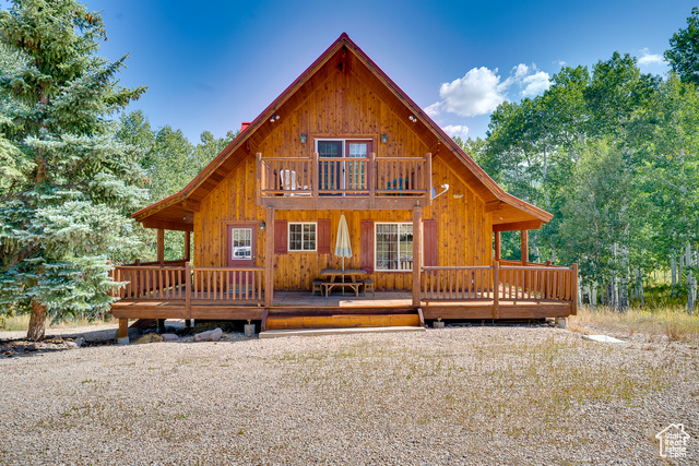 4571 FAWN WAY Heber City, Utah Pristine cabin in Upper Timber Lakes. This well cared for cabin is perfect for full time living or vacation retreat. Mature aspens and pines, easy approach with expansive parking, plenty of space and a 2 car tandem garage! Spend your evenings on the wrap around deck watching the wild life roam or enjoy the wood burning stove. Large great room & dining room, 4 bedrooms (two with private decks), 3 bathrooms and a large laundry/utility room with a new tankless water heater. Plenty of room for the entire family. Currently sleeps 18, as set up. Furnishings negotiable. Timber Lakes is a private community and offers year round recreation with hiking/biking/atv trails, multiple private lakes, and direct access to some of Utah's best snowmobiling country! Gated and secured access. Schools and shopping are just 12.5 miles and Wasatch County buses pick up at the entrance. With Salt Lake City just 56 miles away this location offers mountain living with easy access to major metropolitan amenities. Square footage figures are provided as a courtesy estimate only. Buyer is advised to obtain an independent measurement.