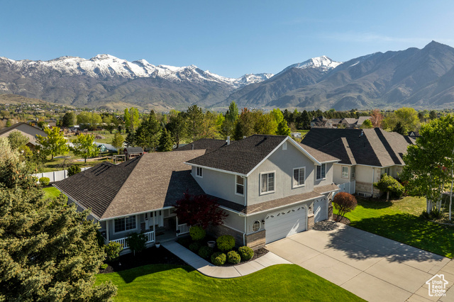 5604 W 11350 N Highland, Utah Don't miss your chance to buy in Highland! Thirty years ago, the sellers built their dream house in the tranquil community of Alpine Shadows. Move-in ready, this one owner house has been meticulously maintained from top to bottom, inside and out! Designed to maximize the view of the backyard from the open floor concept main living area, you'll enjoy the lush, spacious backyard, the covered deck, the soft sound of the waterfall and sight of the swing set. All of this and a breathtaking view of the Wasatch mountains! Main floor has an updated kitchen, modern paint scheme and gorgeous hardwood flooring on the main. Downstairs is an inviting area for game nights with a kitchenette and gas fireplace. Downstairs laundry room could be converted into a bedroom. (Original Maytag washer and dryer work marvelously!) Cold storage with shelves and a private entrance from the garage. The bonus of this house is an above garage, spacious, sunny, clean 2 bedroom, one bathroom ADU. Features a huge walk-in closet with window and bench, separate water heater and HVAC, builtin ironing board and private deck, laundry room and separate entrance. Near schools, shopping, parks, bike trails, Highland Glen Park and Timpanogos temple. Visit www.YouTube.com/Summit Sothebys for video.