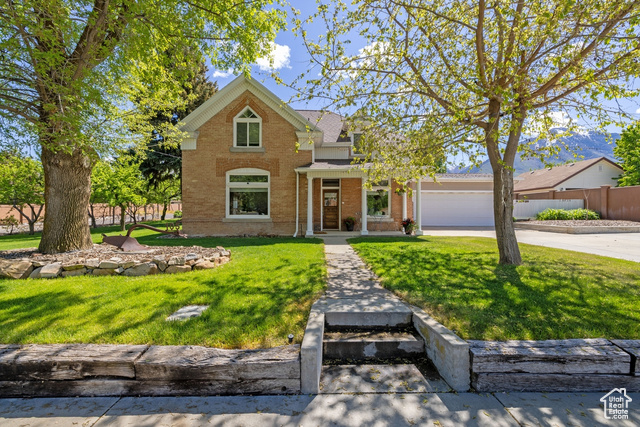 105 S 500 E Salem, Utah Offers reviewed after open house on Saturday May 10th by 5 PM. Want the OLD with everything NEW? This historic brick Victorian style house was constructed in 1902. The home retains its historic architectural integrity and all the new amenities you would want and need. It offers historic charm on its .67 acres. Enter onto the nice gabled front porch. As you walk into the house you are greeted into the parlor where it is cozy and a comfortable place to visit. A half bath for your guests accesses from the parlor. The home is beautifully remodeled and restored throughout and still has intact the nice wood moldings and trims along with its original lead glass windows. Between 2013 to 2021 there was major remodeling done. The foundation has been reinforced, Roof completely torn off, new wood and shingles installed. Radiant heat installed and runs under the tiled floors in the rear family room, kitchen areas and additional runs. A High-end tankless water heater, boiler system, New double pane windows with Argon gas, Central Air conditioning can be used as a heater with several mini splits throughout the house, were all new too. No expenses spared. All plumbing replaced including the water main to the street and the sewer line. Also used the CIPP for extending the life of the pipes. All new electrical through-out the home and out buildings Oversized 2 car garage with opener & room to open wide the car doors. Original brick exterior with concrete Hardie plank siding on additions. A large family room addition onto the back of the house. Lots of dining space, Tile and Red Rock Quarts countertops, slow close cabinets and a kitchen bar. There is a main floor Primary bedroom with walk-in closets, and full bath. Upstairs has wonderful family space for watching TV or a game room. It also has a nice office and 3 bedrooms and a bathroom with a shower. The beautifully landscaped yard includes a fenced backyard with garden beds with water spigots and drip hoses, small orchard with fruit trees and several varieties of grape vines. An old pioneer cabin/shed still sits in the yard on a concrete pad. Fully fenced. There is a 875 sq ft workshop with shelves & power. A large commercial canopy/carport with power. Plenty of RV parking and backyard access. A large concrete patio for entertaining family gatherings or large groups. There is a cold storage room and a closet in the basement. The house continues to be well maintained and shows very well. Don't regret by missing out on the once in a lifetime opportunity to see this home and making it yours today.