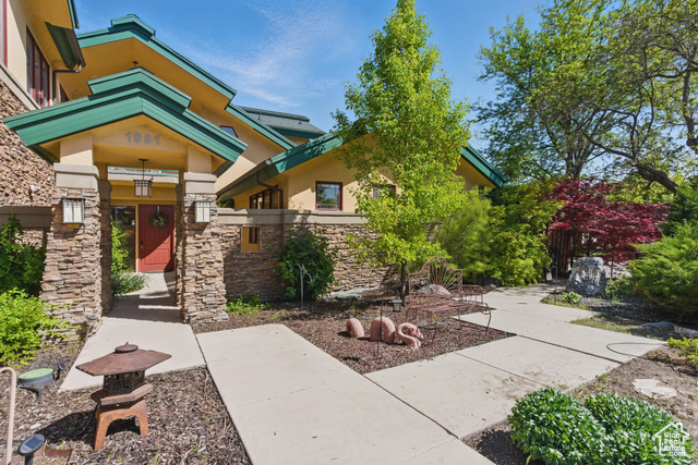1991 S STATE ST Springville, Utah Welcome to your dream home nestled on a spacious 0.67-acre lot with breathtaking mountain views and all the space you need for comfortable country living. This beautifully maintained 4-bedroom, 5-bathroom home includes a private mother-in-law apartment, perfect for guests, extended family, or potential rental income. Inside, you'll find expansive, open family rooms designed for gathering and entertaining, filled with large windows that flood the space with natural light and perfectly frame the stunning mountain scenery. The thoughtful layout offers a warm and welcoming atmosphere with room for everyone to spread out and enjoy. Step outside into the serene front yard, professionally landscaped with a peaceful pond, waterfall feature, and multiple outdoor sitting areas-ideal for morning coffee or quiet evenings surrounded by nature. The backyard is made with entertaining and children in mind, featuring a large lawn, playground, and a circular concrete path that's perfect for bikes, scooters, and playtime fun. Whether you're looking for multi-generational living, space to grow, or a peaceful escape with every modern comfort, this unique property offers it all in a picturesque mountain setting. The Architect operated his business out a large portion of the upstairs. Includes a breakroom/print room, open office space for employees, a balcony, an office for the boss, and a conference room. Zoning allows for up to 3 unrelated people to be employed. Square footage figures are provided as a courtesy estimate only and were obtained from the original Architectural Plans. Buyer is advised to obtain an independent measurement.