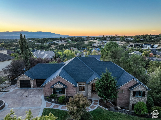 8 SNOW FOREST CV Sandy, Utah Discover the perfect blend of luxury, comfort, and functionality in this stunning Pepperwood estate. Nestled in one of Utah's most coveted 24-hour gated communities, this beautifully updated 6-bedroom, 7-bathroom home offers exceptional main-level living with ample space for family and guests. The thoughtfully designed main floor features a spacious and light-filled layout with large windows framing breathtaking backyard and mountain views. The updated kitchen is a true centerpiece-surrounded by windows and ideal for both everyday living and entertaining. Each main-level bedroom includes its own private ensuite, providing comfort and privacy for everyone. Downstairs, the walkout basement offers three additional bedrooms-including one with an ensuite and two sharing a Jack-and-Jill bath-plus a generous gathering area with a wet bar, a gym, and a theater room. There's even space for a pool or ping pong table, making it the perfect spot for entertaining or relaxing. Step outside to enjoy two expansive, covered decks with incredible views of the valley and mountains. All of this is located within Pepperwood's secure, amenity-rich neighborhood, featuring a community pool, hot tub, tennis and pickleball courts, playground, and scenic walking trails-all just minutes from world-class skiing, hiking, dining, and shopping. Square footage figures are provided as a courtesy estimate only and were obtained from an appraisal. Buyer is advised to obtain an independent measurement.