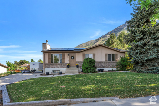 255 E 1230 N Springville, Utah Charming Rambler in the Scenic Benches of Springville. Nestled in a picturesque setting, this delightful rambler offers comfort, character, and breathtaking mountain views. The kitchen boasts wooden cabinetry, a built-in dishwasher, and ample storage space. Sunlight fills the inviting main living area, creating a bright and cheerful atmosphere. Downstairs, enjoy a spacious second living space complete with a cozy wood-burning stove and abundant natural light. Step outside to a spacious backyard featuring a covered patio, perfect for entertaining or relaxing while taking in the stunning mountain backdrop. Additional highlights include fully paid-off solar panels, helping you save on energy costs year-round. Ideally located near beautiful hiking trails, parks, shopping, dining, and more! Measurements provided as a courtesy only, buyer to verify all info.