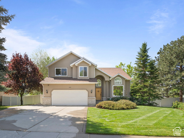 1802 E GRACEY LN S Sandy, Utah Welcome home to 1802 Gracey Ln, nestled in a highly desirable area of Sandy! This stunning residence offers a perfect blend of elegance, comfort, and functionality. As you enter through the front door, you're greeted by a bright and inviting formal living and dining area, filled with natural light and soaring ceilings that create an open, airy atmosphere. The hardwood floors throughout the main level add a touch of warmth and sophistication. The spacious kitchen features beautiful granite countertops and opens seamlessly to a second living room ideal for family gatherings or entertaining guests. Upstairs, you'll find the primary bedroom with a walk-in closet and a luxurious ensuite bathroom featuring a euro glass shower and double sinks. There's also a second full bathroom and two additional bedrooms on this level, perfect for family or guests. The walkout basement provides even more space with a large family room, an extra bedroom, and a three-quarter bathroom perfect for hosting or relaxing. For those who love to entertain outdoors, the backyard is a true oasis! It boasts tall mature trees for privacy, a Tuff shed for storage, and a beautiful Timbertech deck and pergola installed in 2023, complete with a gas line ready for your BBQ grill. Extra insulation was added to the garage ceiling and an insulated garage door. Architectural roof with a 50 year warranty, rain gutters and Leaf Guard was installed in 2020. All new Milgard Trinsic windows were installed in 2023. This home truly has it all-style, space, and an ideal location. Square footage figures are provided as a courtesy estimate only and were obtained from prior appraisal. Buyer is advised to obtain an independent measurement. Buyer/Buyer Agent to verify all info.