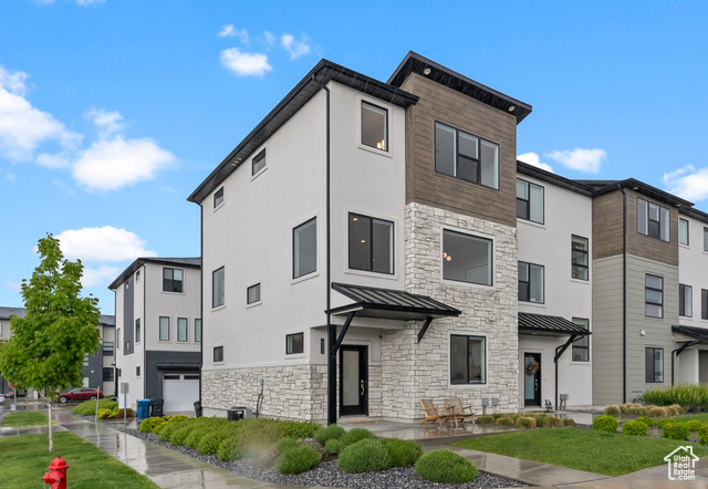 422 S 700 W American Fork, Utah This beautifully maintained and move-in-ready 3-story townhome offers the perfect blend of comfort, convenience, and style. Located just steps from the FrontRunner station for effortless commuting, this home features 9-foot ceilings on every level, creating a spacious and airy feel throughout. The middle floor showcases an open-concept floor plan, ideal for entertaining, with large windows that frame breathtaking, unobstructed views of Mount Timpanogos and half of the Wasatch Front. The modern kitchen flows seamlessly into the dining and living areas, offering both function and beauty. With cabinets to the ceiling, an oversized island, quartz counters, and beautiful backsplash, this is not one to miss! Upstairs, you'll find three generously sized bedrooms and two full baths, including a luxurious primary suite that also enjoys those incredible mountain vistas. The lower level includes a private bedroom and full bath-perfect for guests or even a home office. Loaded with upgrades and meticulously cared for, this home is a rare find in a prime location. Don't miss the opportunity to own a move-in-ready townhome with unmatched views and commuter-friendly convenience.