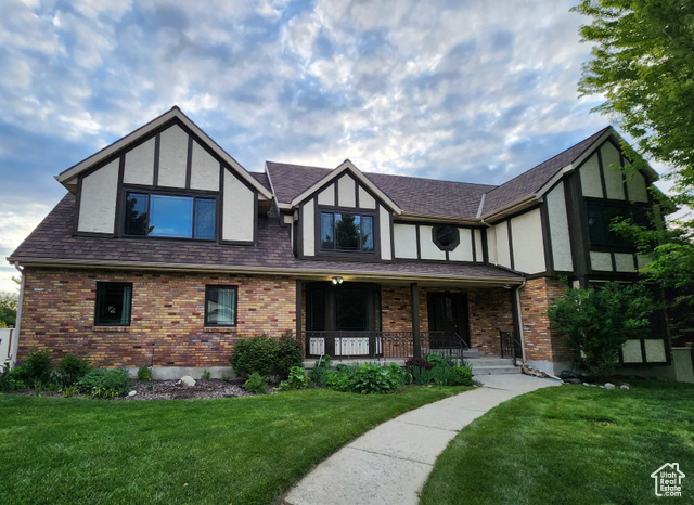 Welcome Home - Charming Tudor Style home featured in Parade of Homes, 1983!  With its beautiful mountain views, you are going to adore this executive 6 bd., 3.5 bath home. 5100 sq ft. multi-generational house and estate, located in East Sandy, in an exclusive neighborhood. The home, grounds, and gardens have been meticulously cared for by the current owner for the last 30 years, with no expense spared. Current owners installed 50 year shingles (approx 15 yrs old), double pane windows, and charming outside trim. You'll love the specialty plants, mature trees, fully fenced rear and side yards, and plentiful outdoor living and dining areas (covered decks and patios) for three season outdoor entertaining. Upstairs, double doors lead to a full master suite complete with a private sitting room WITH a second fireplace, AND a private master suite balcony surrounded by tree canopies, two skylights, an enormous en suite bathroom with jetted tub, double sinks, walk-in shower, and a GIANT walk-in closet. You will enjoy hosting many family dinners and cooking in the chef's kitchen with two convection ovens, downdraft countertop grill, large pantry, granite tile counters, island bar, semi-formal AND formal dining attached. Off the kitchen, there is a main floor family room with a gas/wood fireplace with built-in cabinets for storage, and custom natural wood shutters. The family room has direct access to the covered back porch perfect for outside dining. Don't miss the formal living room, workroom, oversized two car garage with spigots, four additional off-street parking spaces and FULL Daylight lower level with huge second family room, new luxury carpet, & private entry- ready for a quick Accessory Dwelling Unit (ADU) conversion if preferred, but currently flowing as a single family setup. NEVER run out of hot water with two water heaters, PLUS double furnaces, AND double air conditioners. Other details include over-sized bedrooms; a second walk in closet with extra closet space in many of the rooms; a generously sized upstairs laundry room featuring custom cabinetry, a full sized sink, and tiled floor-sink for your washer and dryer. Also, a vaulted attic storage space; a food storage or safe room; and easy access to two freeways (10-15 min). The extra wide hallways, interior wood trim and neutral color pallet throughout are waiting for your personal touch! Agent Related to Seller.