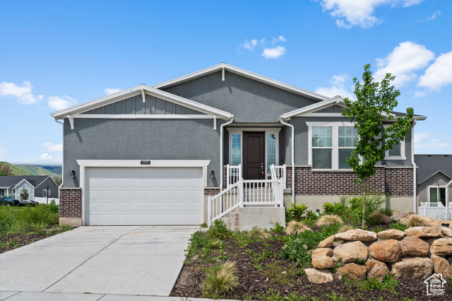 2990 S CRANER PEAK DR Magna, Utah Come see this gorgeous 1525 Craftsman home in a great community near schools and highway access! Inside you will find many stunning amenities such as a modern kitchen with white laminate cabinets, quartz counters and stainless steel gas appliances. Box windows at the kitchen nook & owner's bedroom provide lots of extra space and light while durable flooring includes laminate hardwood flooring, carpet and vinyl tile. The owner's bathroom highlights cultured marble shower surrounds and chrome hardware. 2 tone paint, energy efficient options, can lighting and a wood railing at the stairway are just a few of the other options you will find highlighted in this home! Come check it out today!