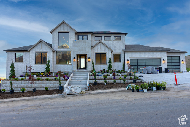 1171 E 430 S Santaquin, Utah A modern French insiperd masterpiece with breathtaking views of the mountain valleys and Utah Lake. Exceptional craftsmanship meets innovative design: radiant backlit epoxy beams, arched custom fridge/freezer doors, 14-foot island with Taj Mahal sink, smart-glass master bath, whimsical Rapunzel balcony, indoor daybed swing overlooking mountain vistas, sunset-accented ceilings in reading room, hidden pantry, and advanced lighting. Truly a rare find.