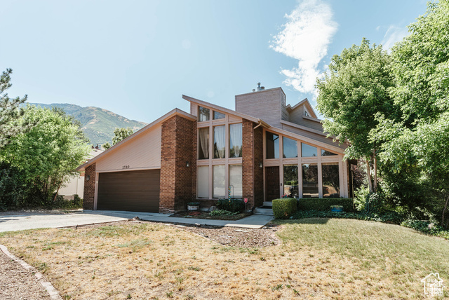 1710 E HIDDEN VALLEY CLUB DR Sandy, Utah This home offers breathtaking mountain views and is just steps away from the Hidden Valley Country Club golf course. The spacious 5-bedroom layout, with tall windows bringing in abundant natural light, creates a welcoming and comfortable atmosphere throughout. The large backyard is perfect for outdoor activities and gatherings. Situated in a quiet neighborhood, this home provides peaceful living with convenient access to local amenities. Enjoy serene evenings with loved ones while taking in the stunning mountain vistas. Square footage figures are provided as a courtesy estimate only and were obtained from county records . Buyer is advised to obtain an independent measurement.