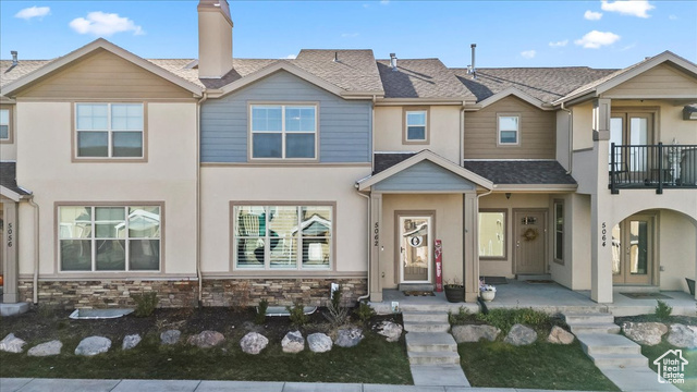 5062 W VALMONT WAY Herriman, Utah **THIS IS A SHORT SALE** Welcome to this charming hillside townhome in the sought-after Rosecrest community of Herriman! Perched on the slopes with stunning mountain views, offering the perfect blend of comfort and contemporary living. The home features an inviting layout with 9-foot ceilings that enhance the spacious feel throughout. The modern kitchen showcases elegant granite countertops and stainless steel appliances, perfect for both everyday meals and entertaining. A cozy gas fireplace warms the main living area, while beautiful laminate flooring flows throughout. The primary suite is a true retreat, featuring a luxurious en-suite bathroom and not one but two walk-in closets. Two additional bedrooms and a convenient second-floor laundry room with ample space complete the upper level. The unfinished basement provides excellent potential for future expansion and customization. Community amenities include access to a clubhouse, pool, and gym. Families will appreciate the playground just steps from the front door. Recent updates include new windows and stucco, ensuring both beauty and durability. Close to shopping, parks, schools, and churches This Rosecrest townhome offers the perfect combination of location, comfort, and community amenities, all while providing the space and flexibility for your future needs.