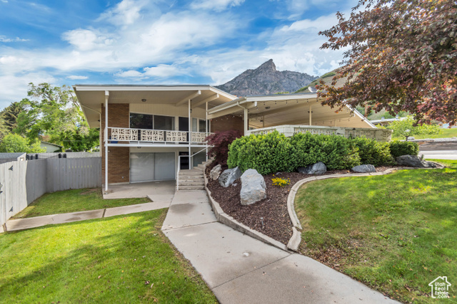 1485 E 1850 N Provo, Utah Discover this beautifully updated mid-century home perfectly situated just east of the new LDS Provo Temple and Brigham Young University. Nestled on a quiet street, this property offers modern upgrades while maintaining timeless character. Inside, you'll find hardwood floors, updated kitchen tile, sleek countertops, and newer appliances that make the kitchen shine. The home is equipped with newer Low E windows, an upgraded A/C unit, and a recently installed EV charging station-plus additional electrical improvements throughout. The exterior features thoughtful landscaping, a full sprinkler system, and a large sports concrete pad perfect for recreation. Enjoy summer evenings under the expansive covered outdoor seating area, surrounded by fruit trees that yield delicious peaches! A spacious storage shed provides added functionality. This is a rare opportunity to live in one of Provo's most desirable neighborhoods with proximity to BYU, the temple, and mountain trails. Move-in ready and perfect for entertaining-schedule your showing today!