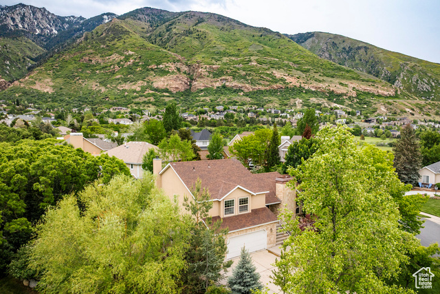 2165 E GAMBEL OAK DR S Sandy, Utah Discover unparalleled back deck views of the breathtaking Wasatch Mountains in this multi-level home located in the highly sought-after Hidden Oaks community. Enjoy access to exceptional amenities, including a brand-new swimming pool with three lap lanes, a tennis court with two pickleball nets, a playground, and a racquetball court. Plus, you're just moments away from Hidden Valley Country Club and only a short 20-minute drive to the world-renowned ski resorts of Snowbird and Alta. Step inside to an airy, light-filled floor plan featuring a spacious living room with vaulted ceilings and a formal dining area. The heart of the home is the beautiful kitchen, adorned with stylish gray-painted cabinets, a stunning tile backsplash, and premium granite countertops. From the kitchen and breakfast nook, seamlessly transition to an expansive, maintenance-free deck that's perfect for entertaining, offering evening shade and stunning mountain views. Upstairs, find three generously sized bedrooms, including a luxurious primary suite with its own private balcony boasting incredible mountain vistas. The expansive primary bathroom features elegant travertine tile, granite countertops, double sinks, a jetted tub, and a roomy shower, ensuring a spa-like experience. An updated guest bath serves the additional bedrooms upstairs. The lower level offers even more living space with a versatile multipurpose room, two additional bedrooms, and a convenient 3/4 bath. Don't miss this incredible opportunity to live in an exclusive neighborhood that embraces all the recreational activities Little Cottonwood Canyon has to offer. Your dream home awaits!