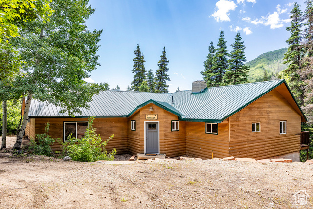 2387 HAPPINESS TRL W Midway, Utah Fabulous setting! Seasonal, Recreational Property. No rentals allowed. Step inside this tasteful cabin nestled in the serene beauty of Midway, Utah. Located amidst the breathtaking landscapes of the Wasatch Mountain Range and State park, this cabin is a perfect retreat for those seeking relaxation, outdoor adventures and a tranquil escape from the hustle and bustle of everyday life. This one-owner home has been meticulously cared for and loved. The exterior features natural log with detailed tongue and groove eaves, a metal roof and newer windows. The wrap around wood decks give way to towering pine trees, offering a sense of privacy and seclusion. The open-concept living boasts exposed wooden beams, laminate wood floors, stone fireplace, kitchen with ample space for gathering. With 5 bedrooms there is room for family and friends to gather. Midway offers amazing outdoor activities year round. Explore the nearby hiking and biking trails, go fishing in pristine mountain streams and listen to the flow of Snake Creek. Close proximity to Park City, Heber and Salt Lake City. The cabin can be accessed by snowmobile or hiking during the winter months and is a perfect base to create lasting memories and experience the beauty of Midway, Utah.