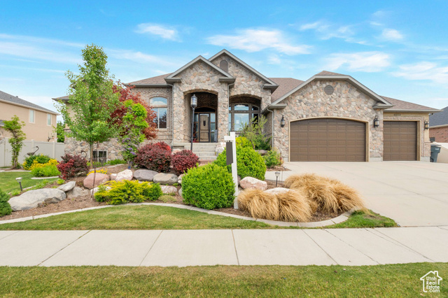 11273 S ALISA MEADOWS DR W South Jordan, Utah Stunning Tuscan inspired home. From the stone and brick exterior to the beautiful landscaping, this gorgeous home has striking curb appeal that will "wow" you from the moment you arrive. This custom 4,600 square foot home offers 5 bedrooms, 3.5 bathrooms and meticulously crafted interior finishes including beautiful woodwork, Venetian plaster walls, granite countertops, and custom copper and steel shutters with differing patinas throughout the rooms. This Unique home boasts an open concept floor plan and provides the perfect space for gathering and entertaining. A spacious custom kitchen with custom tile work and cabinets, stainless steel appliances, a gas range, elevated dishwasher to help provide mercy to your aching back, a large island with bar seating, and a separate dining area that flows seamlessly into the great room. The impressive great room features soaring vaulted ceilings, a cozy stone fireplace, and large windows that provide plenty of natural light and make the space feel inviting and warm. The incredible Owners suite comes with 2 walk-in closets, a double vanity, and a claw-foot soaking tub and separate shower. Basement features include a daylight walkout basement, a family room with surround sound, and a 2nd kitchen. Boasting 7 total garage spaces with a 4 car attached garage with a rear overhead door and a 3 car detached garage/shop space with 220 power. Detached garage dimensions are(26x38) with 9 ft doors. This West Facing home is the entertainers dream featuring a covered deck overlooking a large covered patio with hot tub and grass area with plenty of shade. There is also a commercial tanning bed in the room next to the Hot tub. This home comes complete with some furnishings included. Call agent for a complete list of inclusions. Owner/Agent